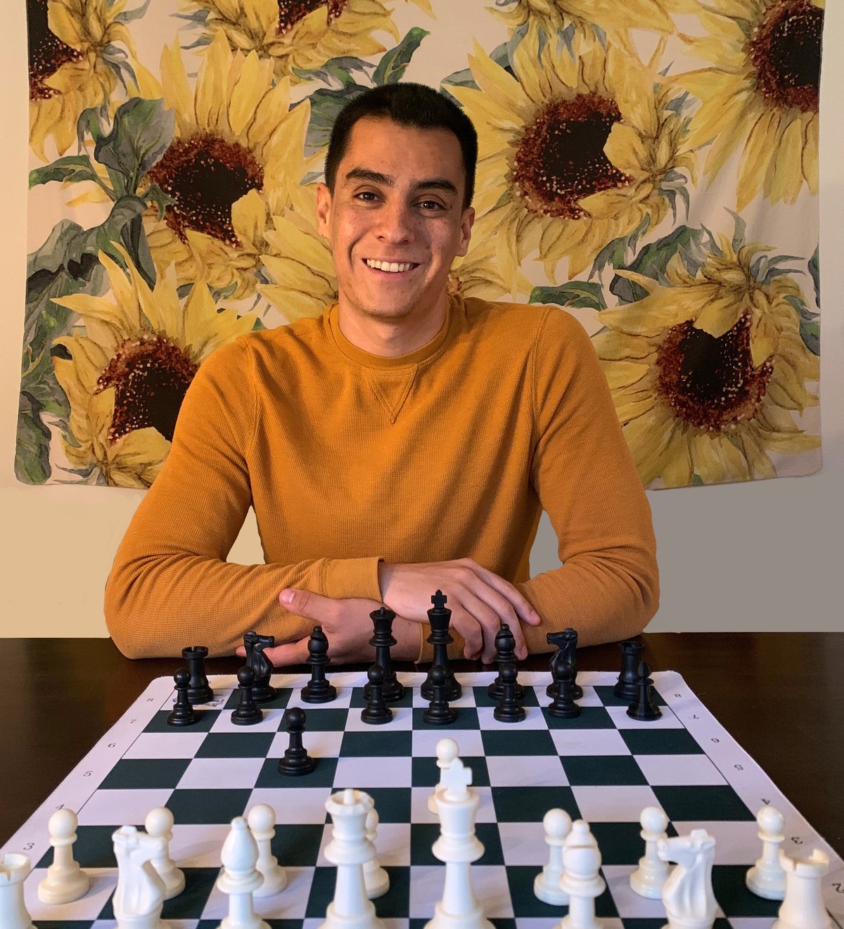 Logan James at a chessboard